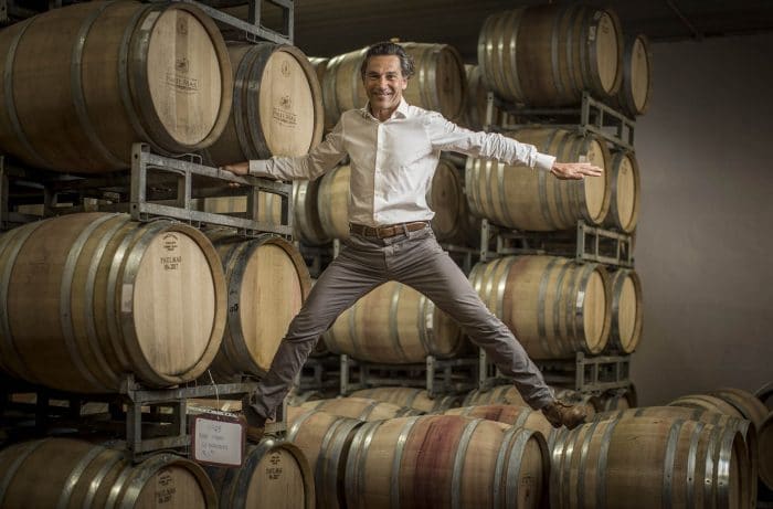 HERO_Domaines_Paul_Mas_Jean-Claude_Mas_with_Barrels_Courtesy_Domaines_Paul_Mas_1920x1280-700×461